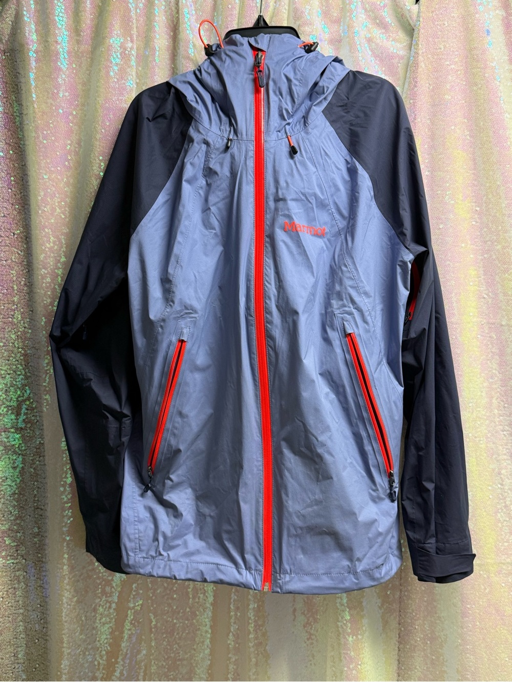 Marmot Women’s Two-Tone Blue Waterproof Hooded Shell Jacket with orange Accents